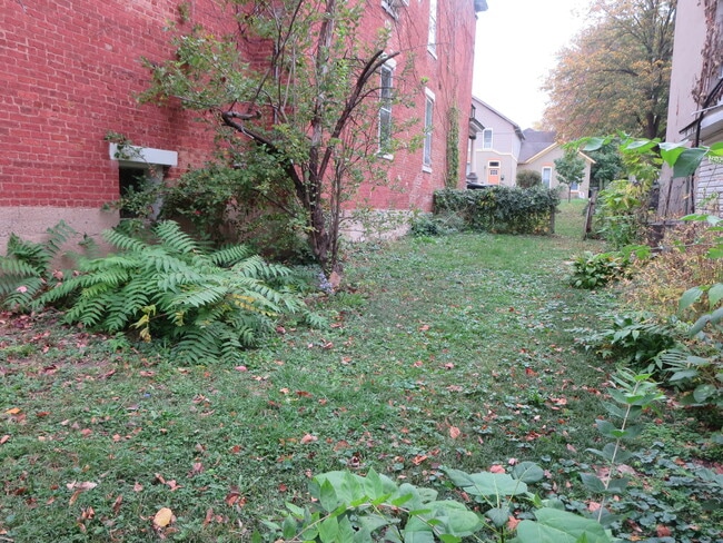 Fenced in section of yard, South side of house. - 204 S 6th St Unit First Floor