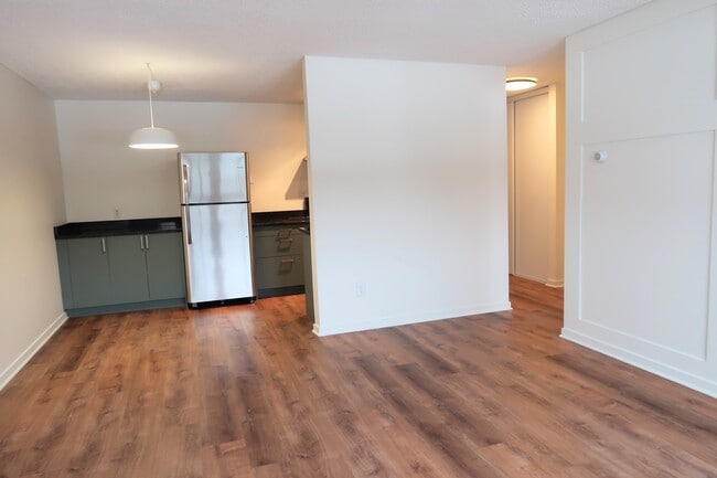Living room to kitchen - 2616 Harriet Ave S #203 Unit 203