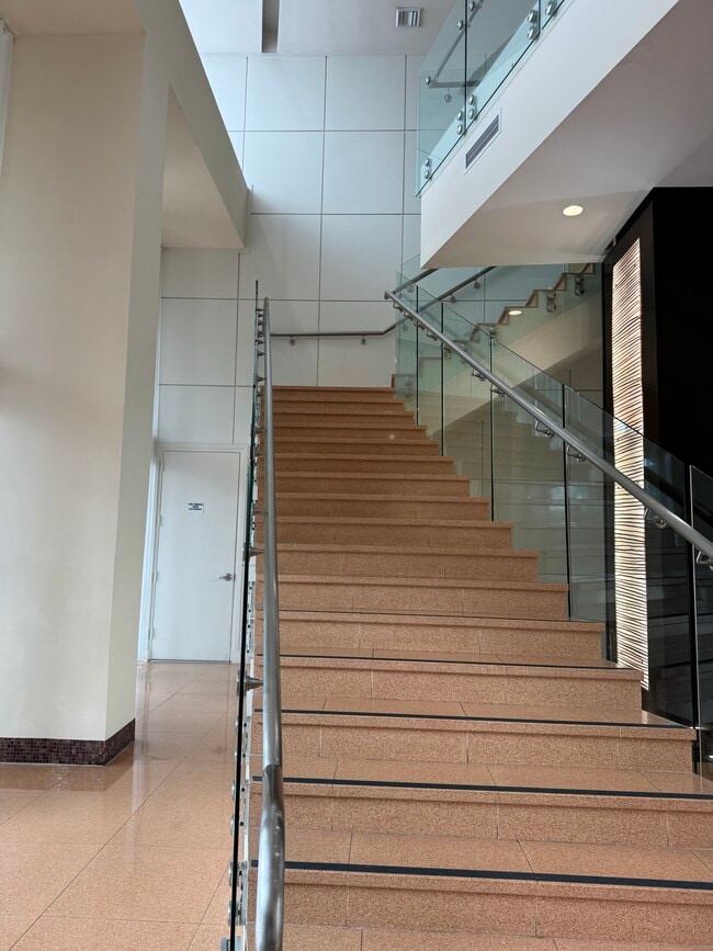 Lobby stairs case - 2775 NE 187th St Unit 221