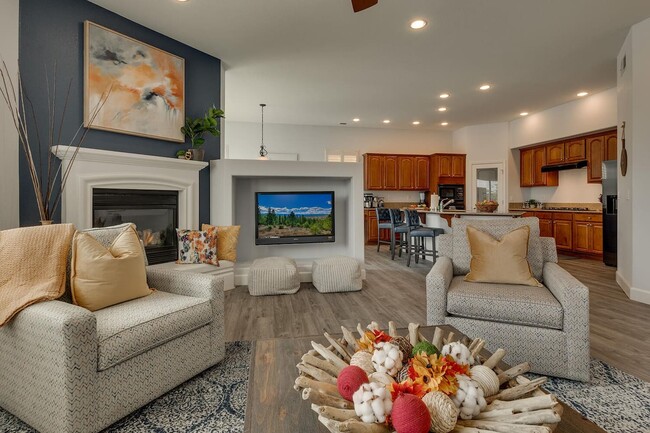 Living room adjacent to the kitchen and dining areas. This open concept home is spacious while also - 1698 Gemtown Dr House