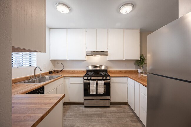 Kitchen with white cabinets and stainless steel appliances