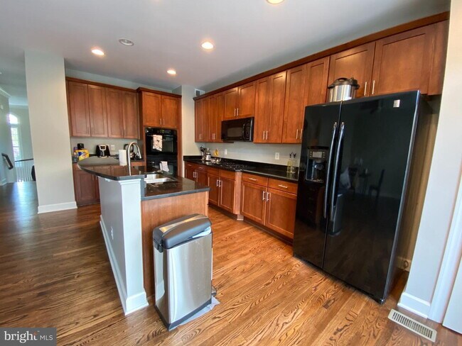 Bright & Spacious End-Unit Townhouse with Two-Car Garage!