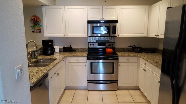 Building Photo - 5410 Chiquita Blvd S Unit 202