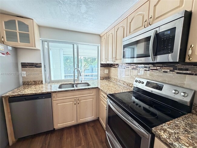 Photo - 9201 Lime Bay Blvd Unit 305