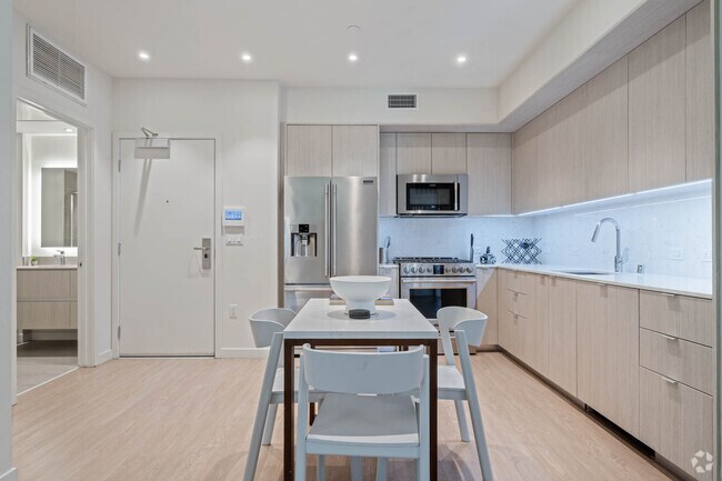 Building Photo - 8820 Belford Ave Unit Prestige Suite 4221B Rental