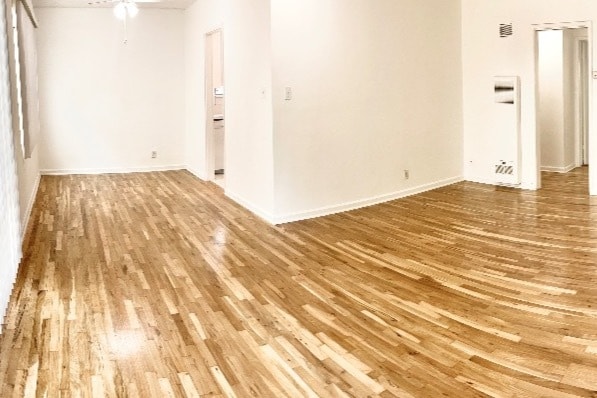 Original hardwood floors in living and dining rooms - 1234 S Westgate Ave Apartments