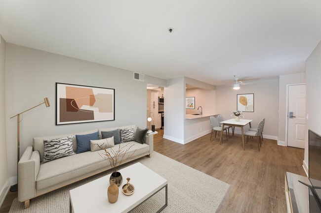 Renovated Package I dining and living room with hard surface flooring