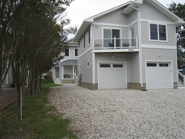 Exterior Street View w/ balcony - 20527 Washington St Unit Garrage Carriage House