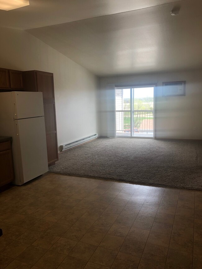 Living room with balcony - Branson Development