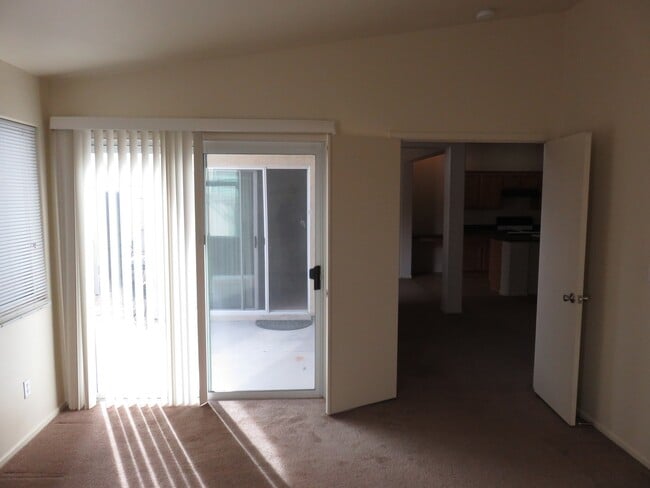 Photo - Huge family room with kitchen nicely tucked in the middle.