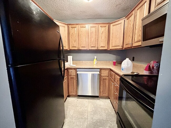 Photo - Top-Floor Plaza Condo with Vaulted Ceilings & Dual Balconies