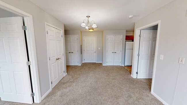 Living Room With Dining Area - Meyer Pointe Senior Apartments