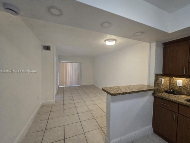 Building Photo - 2441 NW 13th St Unit 62