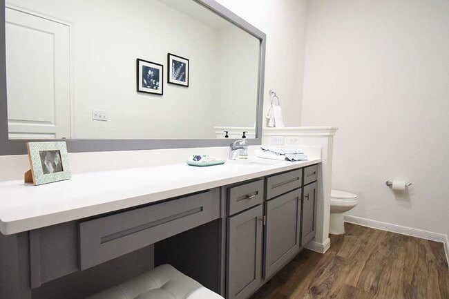 Soaking tubs, framed mirrors and double vanities make up the modern baths