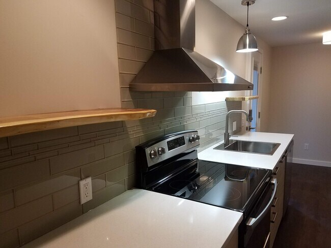 Easy clean glass backsplash and natural wood shelves - 1610 SW Freeman St Unit Apt B
