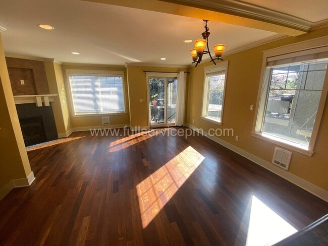 Photo - Spacious townhome with private backyard, garage parking, multiple decks, and a dedicated home off...