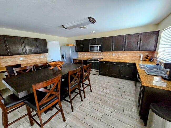 Photo - STUNNING 4 Bed, 2.5 Bath Oasis with Pool Your Dream Home Awaits!