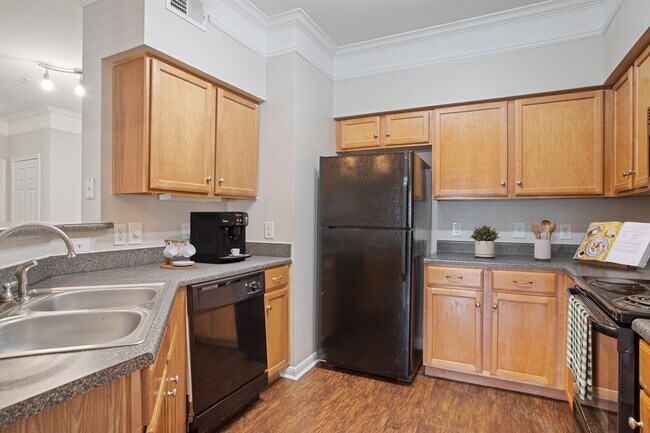 Kitchen with Black Appliances - Carrington Park at Huffmeister Apartments