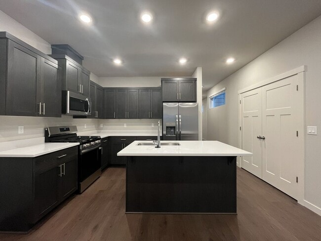 Photo - Exceptional 3-Bedroom Modern Home with Island Kitchen, Spacious Living, and Attached Garage