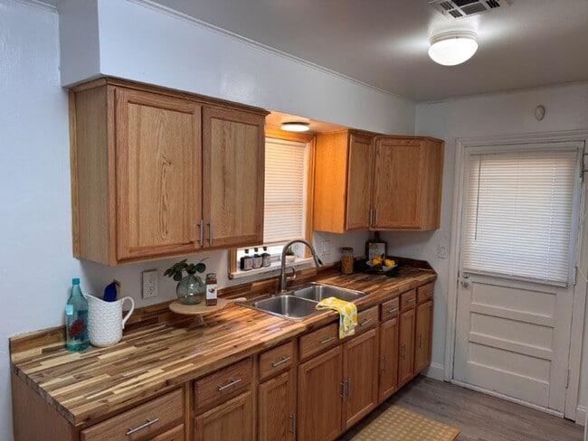 Photo - 2 bed 1.5bath  New paint, new flooring, new range, fenced yard!