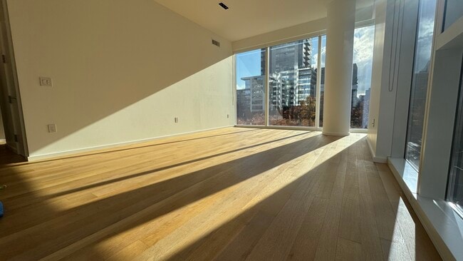 Living Room filled with light - 1075 NW Northrup Unit 314