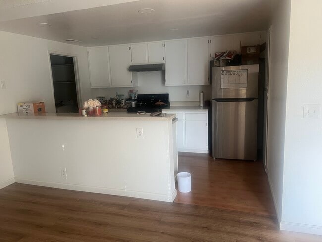 Kitchen area with dish washer, stove/range, fridge and microwave - 73 Silcreek Dr Unit 73