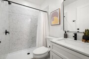 Step into this serene and stylish bathroom, designed with elegance and function in mind.