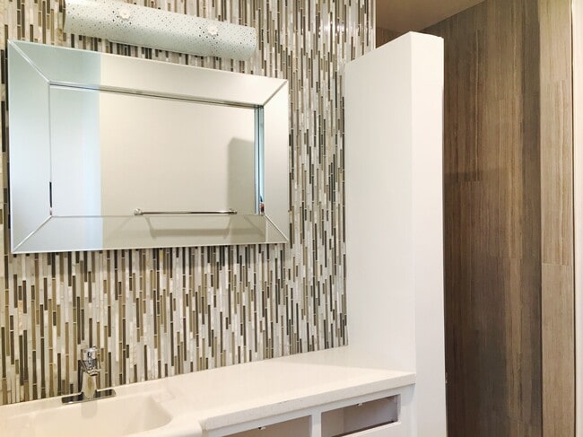 tiled master vanity wall and fixtures - 1214 Rutland Rd Unit 1