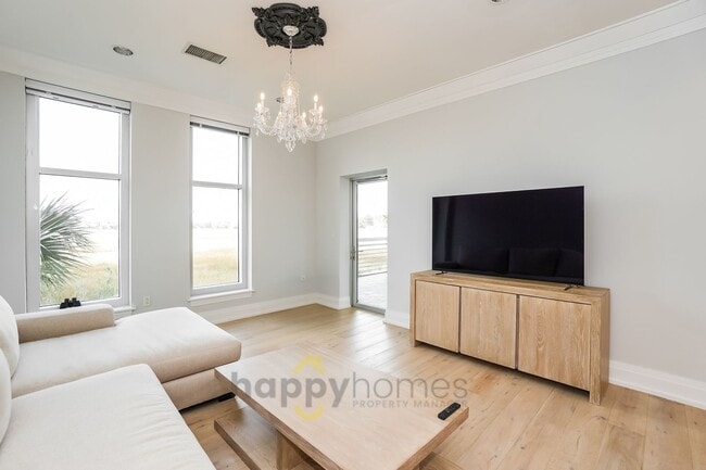 Building Photo - Waterfront Oasis: Fully Furnished 1BR/1.5BA with Marsh Views