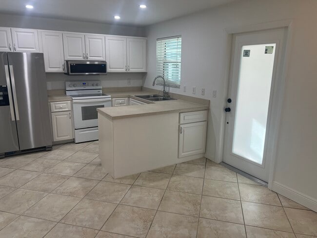 Kitchen and entry door - 1964 Alamanda Dr Unit 5