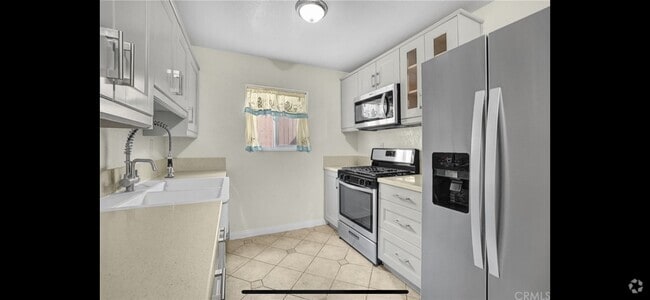 Building Photo - 12828 Ramona Blvd Unit 44 Rental