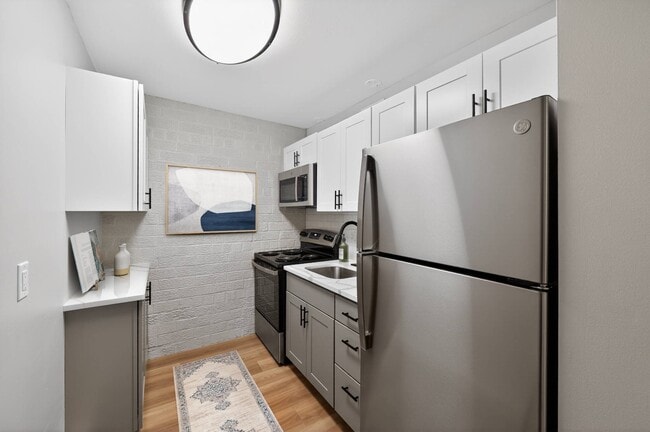 Elevate your lifestyle at Eagle Rock Apartments at Hudson, where modern kitchens combine style and functionality. Enjoy sleek stainless steel appliances and spacious layouts. Schedule a visit today to see your future home! - Eagle Rock Apartments at Hudson
