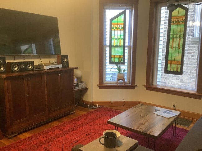 Living room with TV and Stereo - 1913 N Kimball Ave Unit 1R