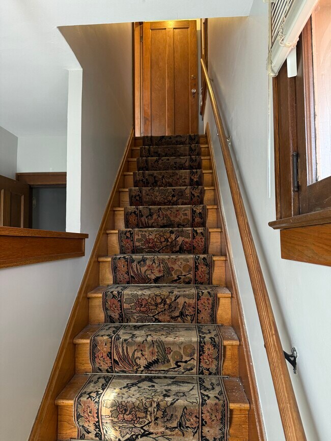 Entry way looking up stairs to apartment - 40 W Tompkins St Unit 40