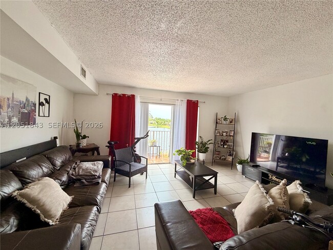 Building Photo - 14919 SW 80th St Unit 210