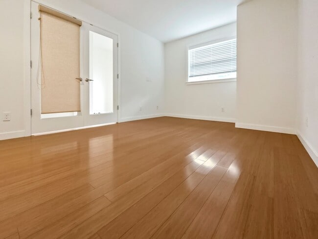 Photo - 3-Story Townhouse | 3 Bed, 3.5 Bath | Central Heating | Hardwood Floors | Carpeted Bedrooms | Off...