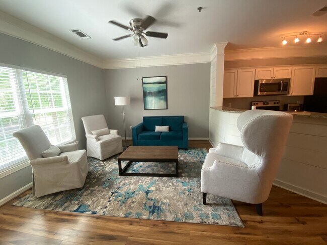 Living room with twin sleeper sofa - 1523 Telfair Way Unidad 1523