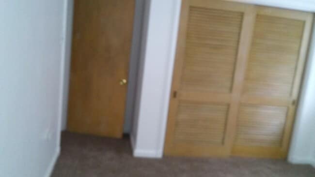 Closet double doors in first bedroom - 8804 Riverview Blvd Unit AptA