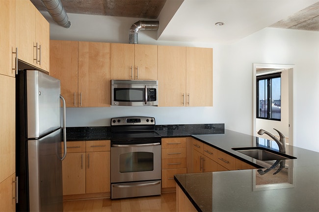 All homes feature granite countertops, stainless steel GE appliances and 42" maple cabinetry - Zoso Flats