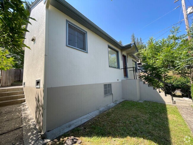 Building Photo - 2 bedroom house with a basement and carport