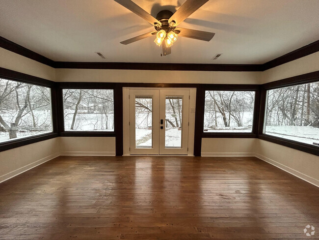 Living room with large picture windows looking to the river - 11761 N River Rd Rental