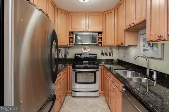 Kitchen with new appliances and dishwasher - 2475 Virginia Ave NW Unit 617
