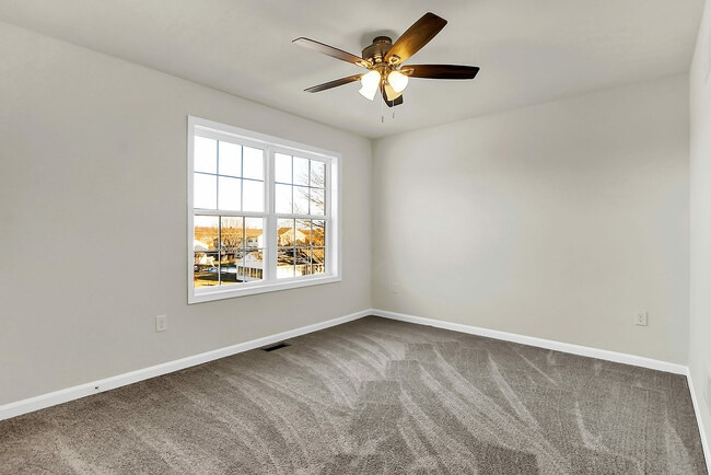 Experience tranquility in this spacious and light-filled bedroom, perfect for your personal retreat.