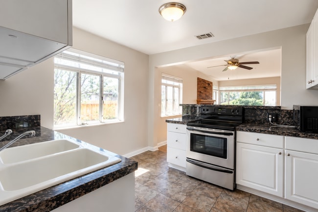 Photo - Gorgeous 4-Bed Gem in Denver with Granite Accents, Cozy Fireplace, & Finished Basement!