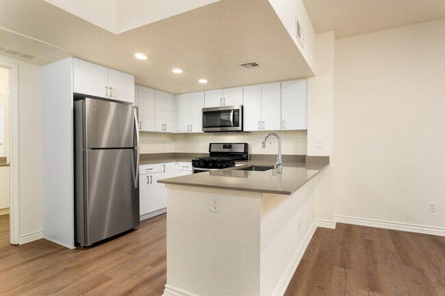 Renovated Package I kitchen and dining area with hard surface flooring
