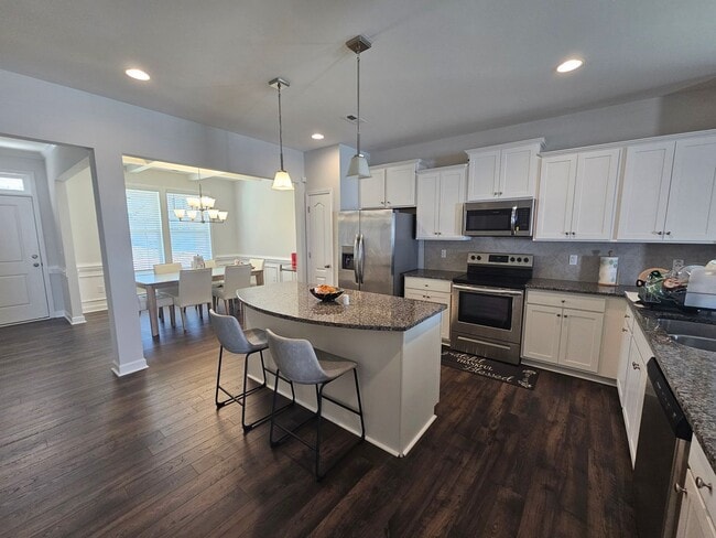 Photo - Like New Home featuring 4 Bedrooms, a Loft, and a fully fenced Yard!