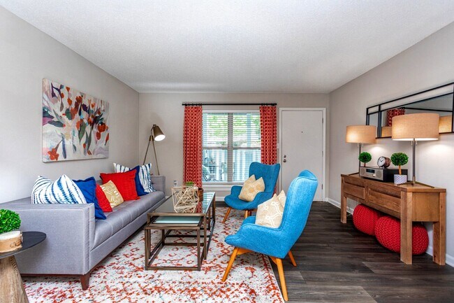 Spacious living room with modern furnishings and natural light.