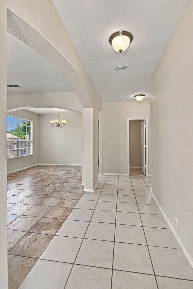 "Spacious Two-Story Home with Multiple Living Spaces and and Expansive Backyard!"