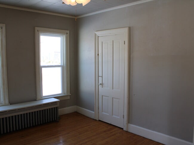 First bedroom with front door access. - 28 5th St Unit Lower