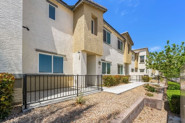 Building Photo - Modern Mosaic Townhome with Stylish Finishes & Resort-Style Community Amenities!